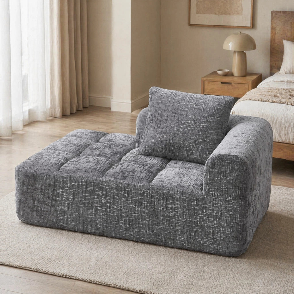 Divano chaise longue in chenille grigio con tasche laterali e cuscino
