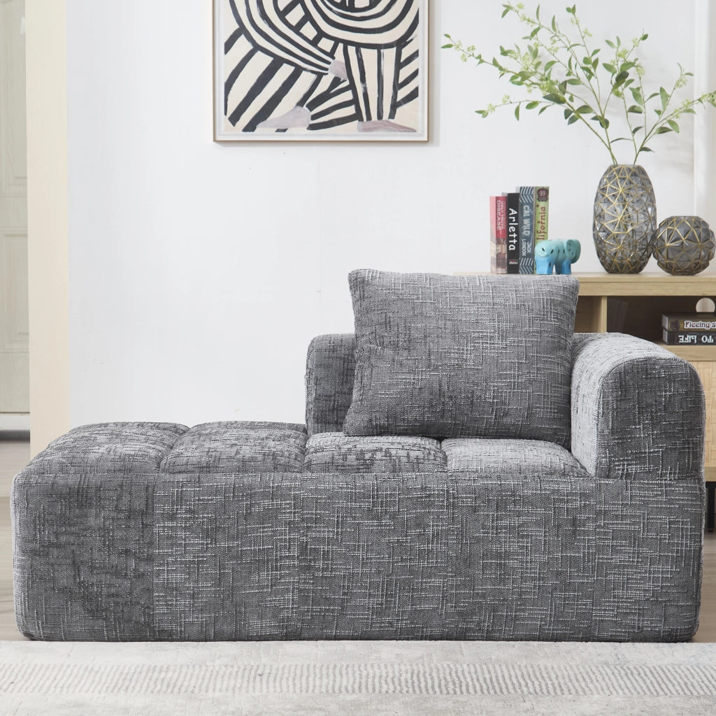 Divano chaise longue in chenille grigio con tasche laterali e cuscino