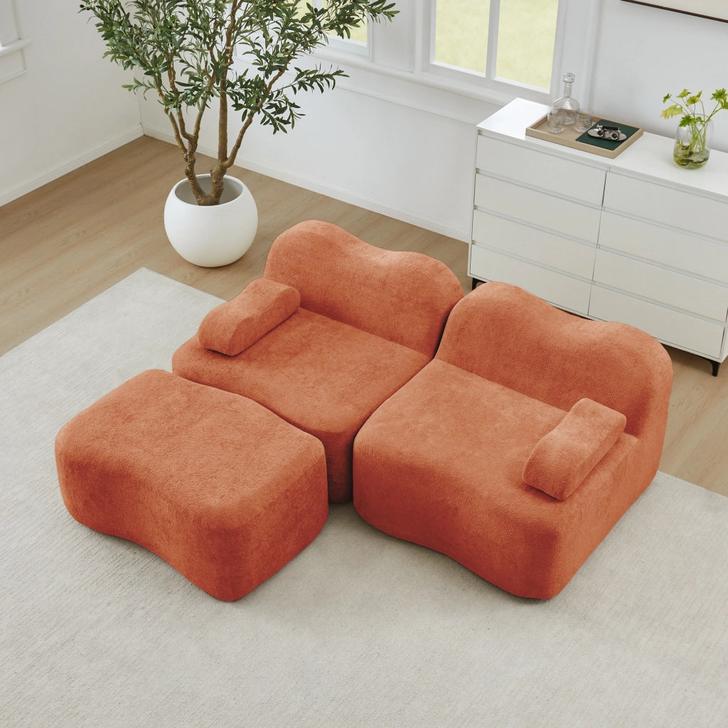 Divano modulare angolare 2 posti con pouf; forma ondulata e cuscino bracciolo mobile; velluto arancione