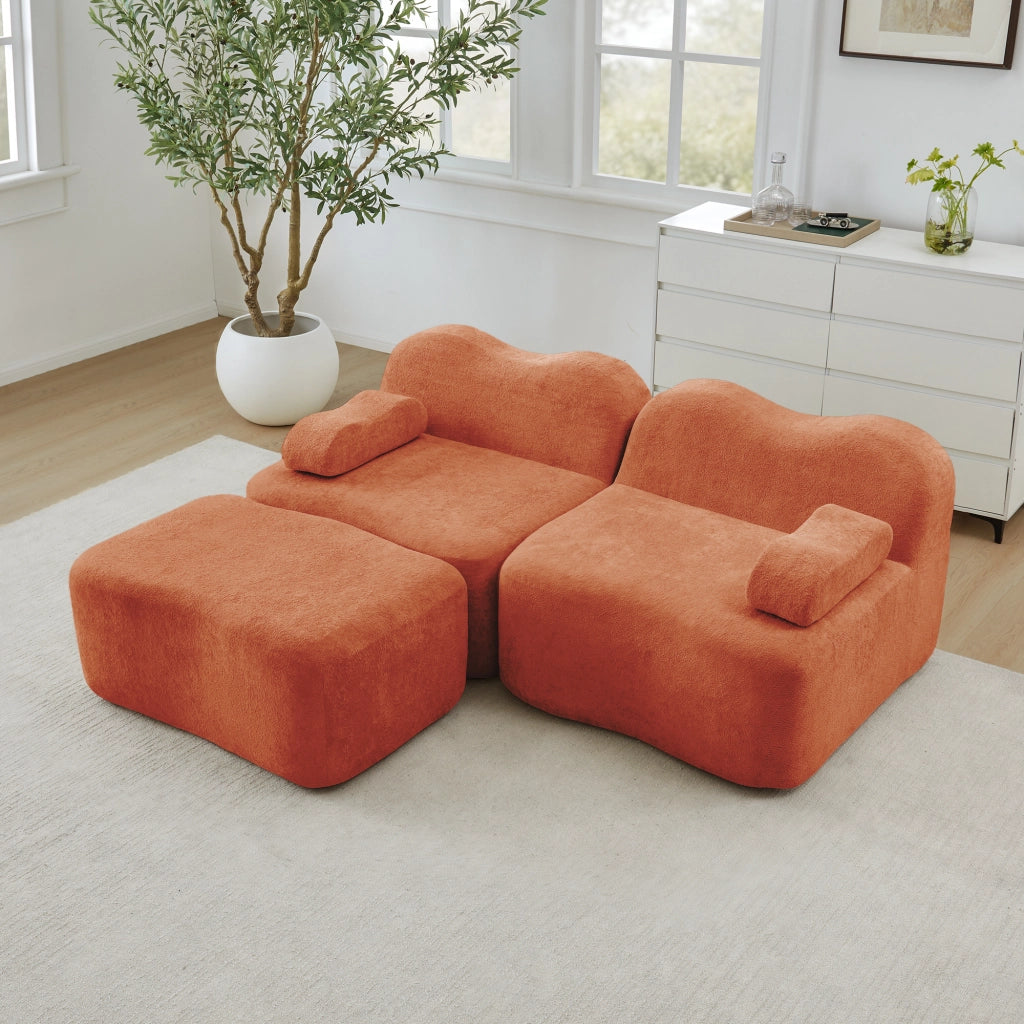 Divano modulare angolare 2 posti con pouf; forma ondulata e cuscino bracciolo mobile; velluto arancione