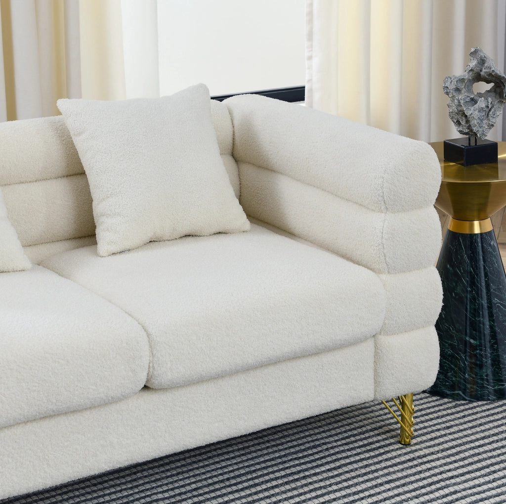 Divano 2 posti in tessuto peluche bianco con molle; dimensioni non comunicate
