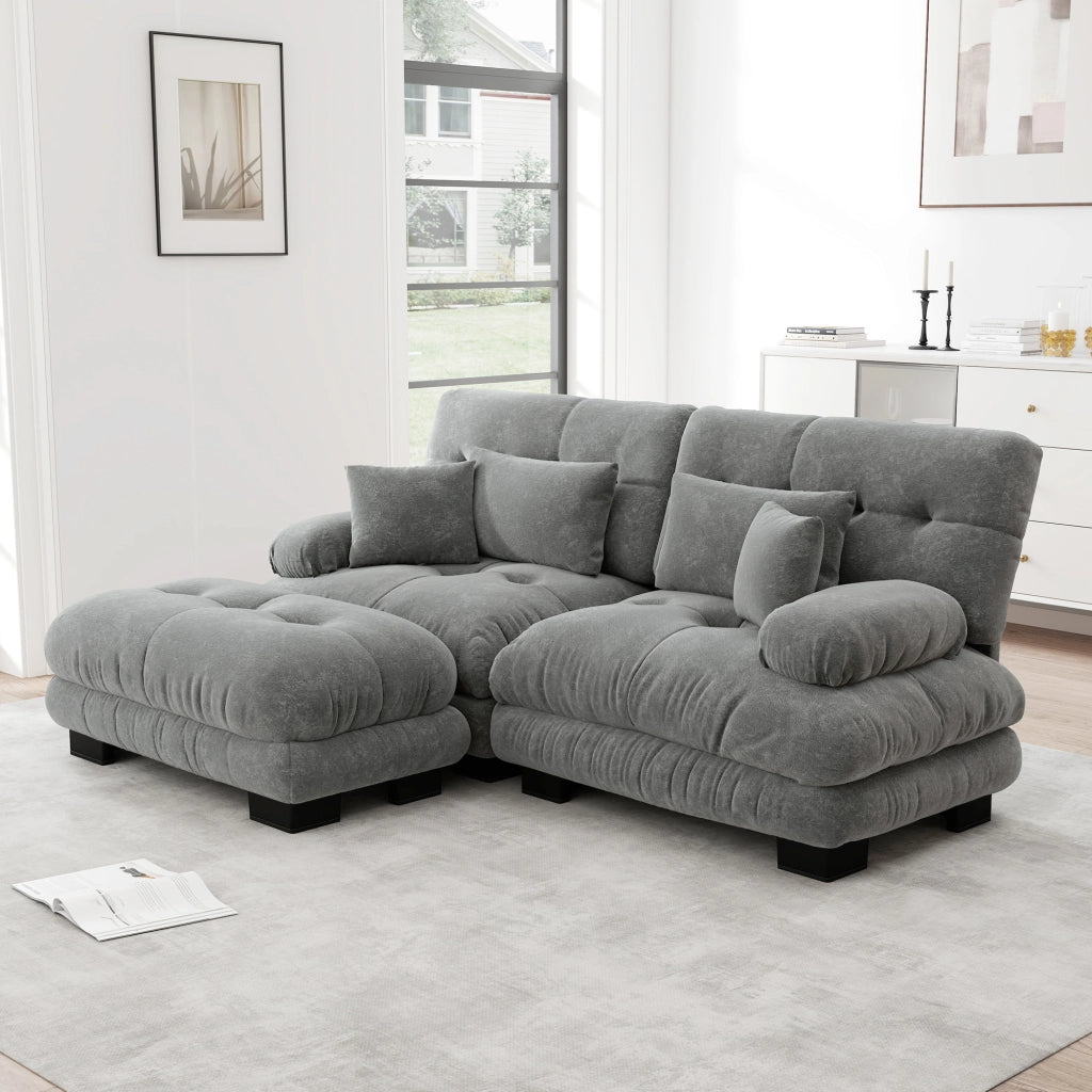 Divano modulare in chenille grigio con pouf mobili; seduta profonda e cuscini di supporto