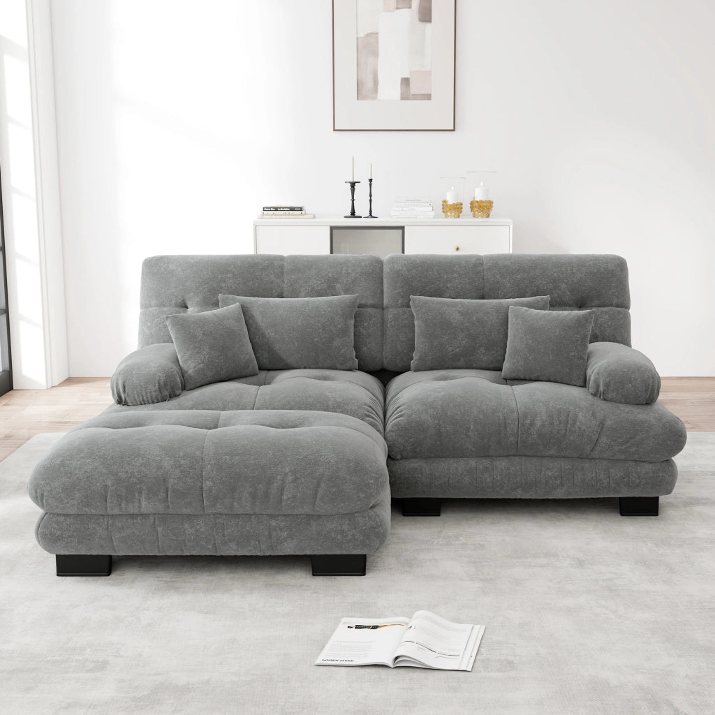 Divano modulare in chenille grigio con pouf mobili; seduta profonda e cuscini di supporto